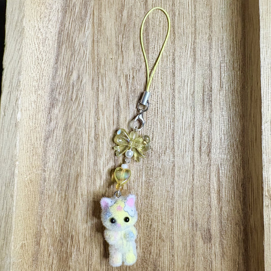 Fuzzy cat phonecharm ~ yellow marble